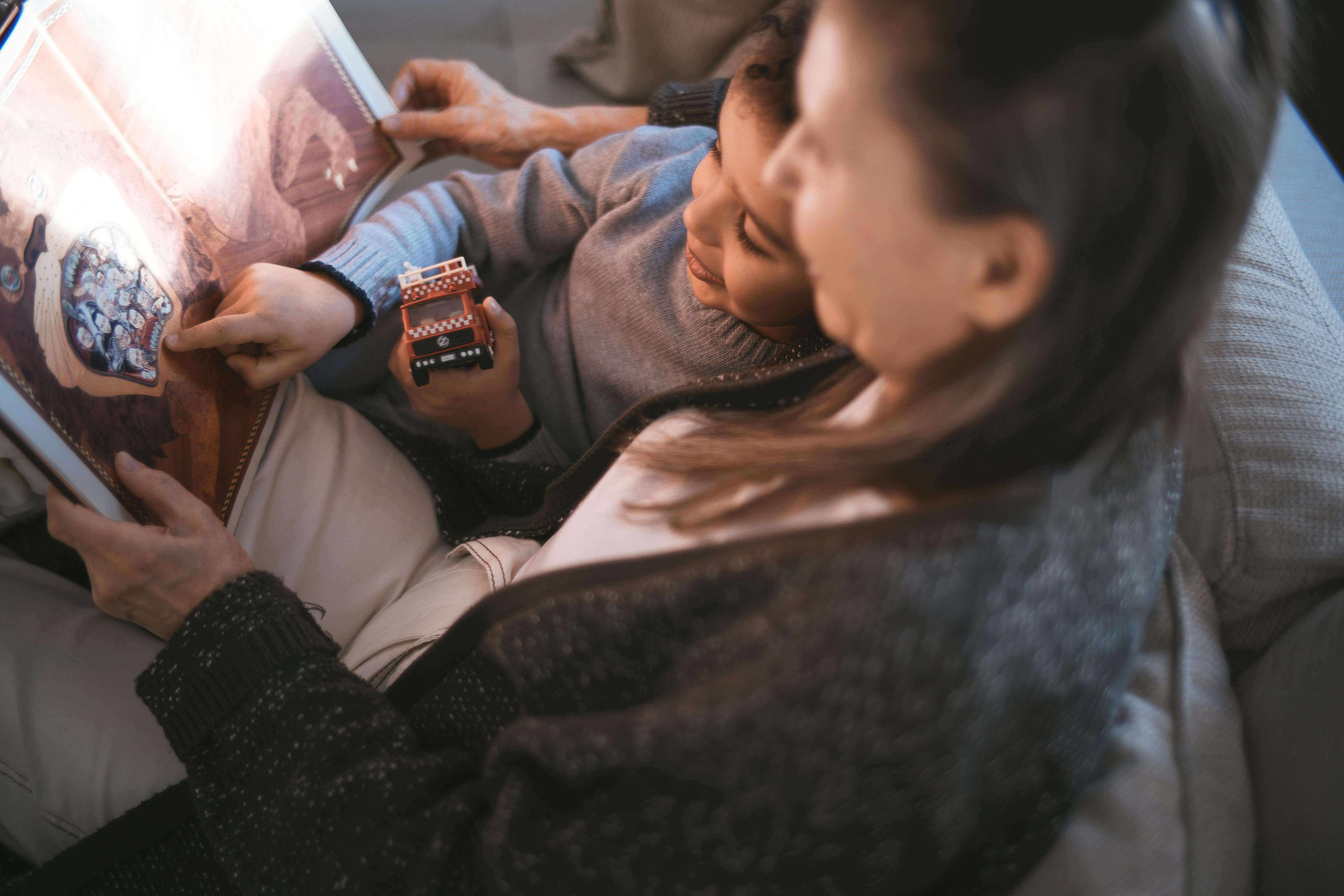 A family relaxing together on a sofa